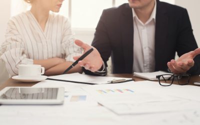 - business colleagues working with documents PLF3KPE | Family Capital Funding